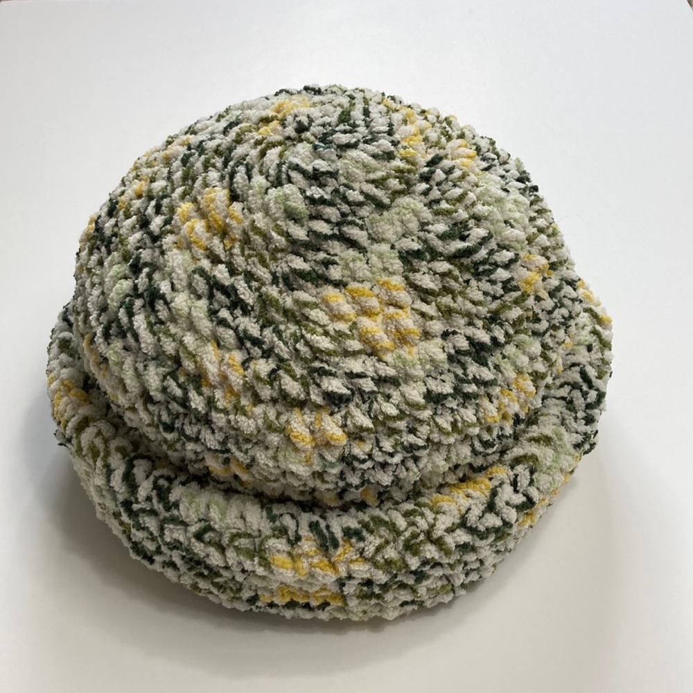 Hand made crocheted beanie NWOT. Multi colored (green, yellow, white) stretchy!!
